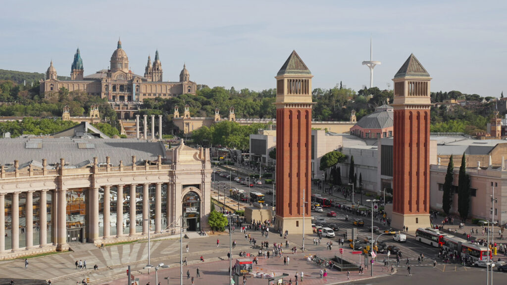 barcelona-spain-april-2023-venetian-towers-plaza-de-spain-city-aerial-view-slide-city--SBI-349584403
